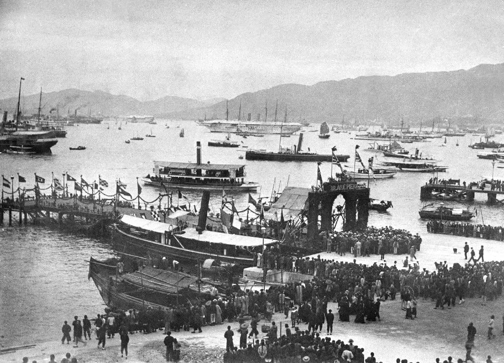 A black-and-white photo of a pier at Hong Kong’s Central district, dated 1900.