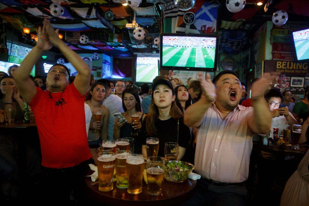 World Cup fans watched Russia vs Saudi Arabia at a bar in Beijing in June, 2018. (Picture: Reuters)