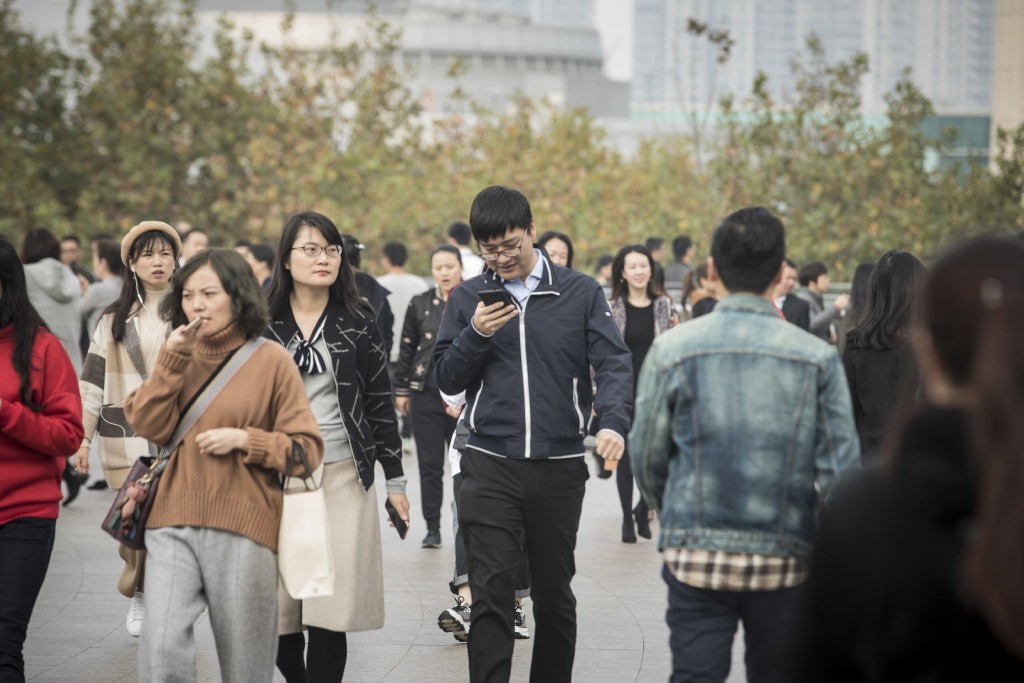 Smartphone users on the streets of Shanghai. (Picture: Bloomberg)