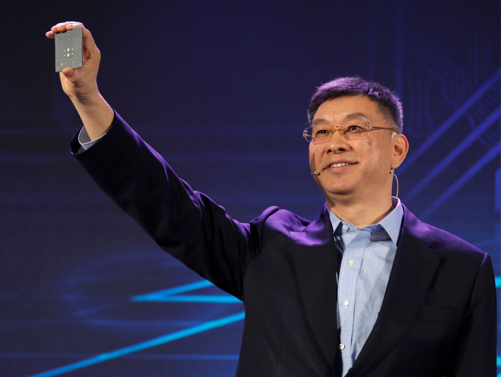 Huawei executive William Xu displaying a processor chip in Shenzhen, China on January 7, 2019. (Picture: Vincent Yu/AP Photo)