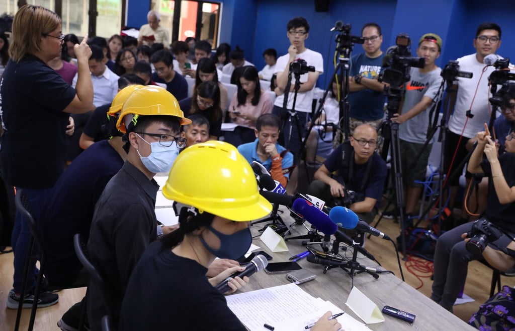 Holding press conferences in face masks and hard hats. (Picture: Sam Tsang/SCMP) Holding press conferences in face masks and hard hats. (Picture: Sam Tsang/SCMP)