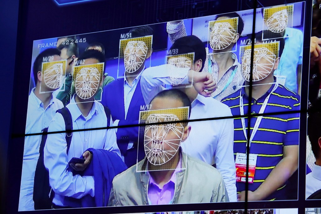 Facial recognition cameras are now standard in China's southern tech hub of Shenzhen. Here Chinese AI company Megvii shows off its Face++ facial recognition at a Shenzhen security expo. (Picture: Bobby Yip/Reuters)