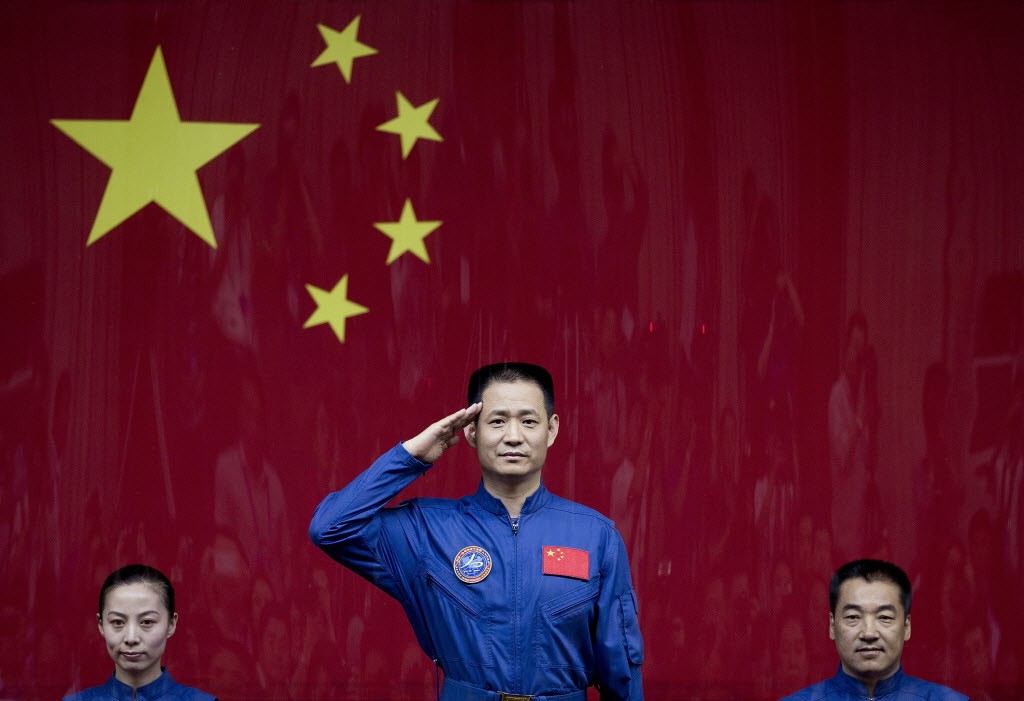 Chinese astronauts Wang Yaping, Nie Haisheng and Zhang Xiaoguang (left to right) before boarding the Shenzhou 10 spaceflight in June 2013. (Picture: AP) Chinese astronauts Wang Yaping, Nie Haisheng and Zhang Xiaoguang (left to right) before boarding the Shenzhou 10 spaceflight in June 2013. (Picture: AP)