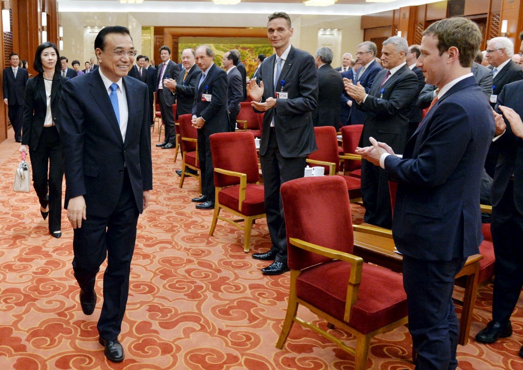 Mark Zuckerberg and overseas representatives of the China Development Forum applauding the arrival of Chinese Premier Li Keqiang at the Great Hall of the People in Beijing in 2016. (Picture: Reuters) Mark Zuckerberg and overseas representatives of the China Development Forum applauding the arrival of Chinese Premier Li Keqiang at the Great Hall of the People in Beijing in 2016. (Picture: Reuters)