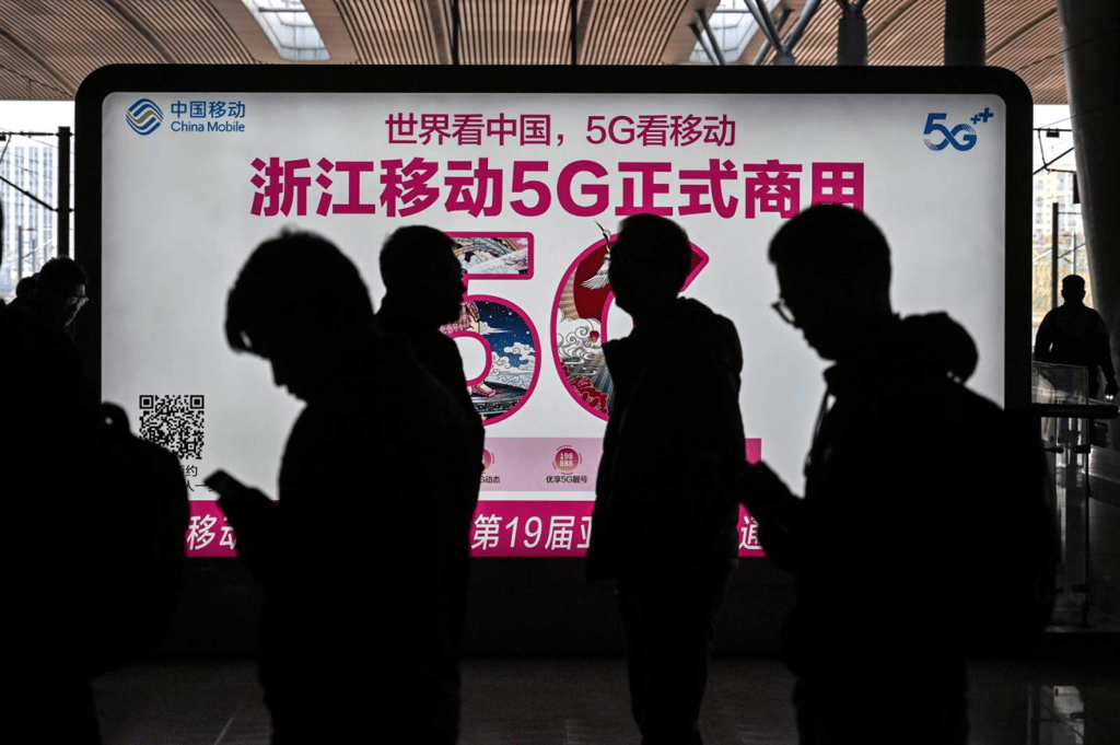 A China Mobile advertisement for 5G internet at the railway station in Hangzhou on December 3, 2019. (Picture: Hector Retamal/AFP) A China Mobile advertisement for 5G internet at the railway station in Hangzhou on December 3, 2019. (Picture: Hector Retamal/AFP)