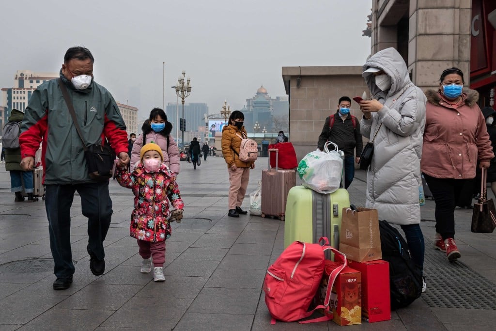 People wearing protective masks to help stop the spread of a deadly virus, which began in Wuhan, at the Beijing railway station on January 27. (Picture: Nicolas Asfouri/AFP) People wearing protective masks to help stop the spread of a deadly virus, which began in Wuhan, at the Beijing railway station on January 27. (Picture: Nicolas Asfouri/AFP)