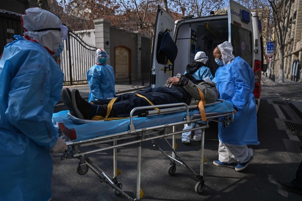 Medical staff in protective clothes carry a patient from an apartment suspected of having the new coronavirus in Wuhan on January 30. (Picture: Hector Retamal/AFP) Medical staff in protective clothes carry a patient from an apartment suspected of having the new coronavirus in Wuhan on January 30. (Picture: Hector Retamal/AFP)