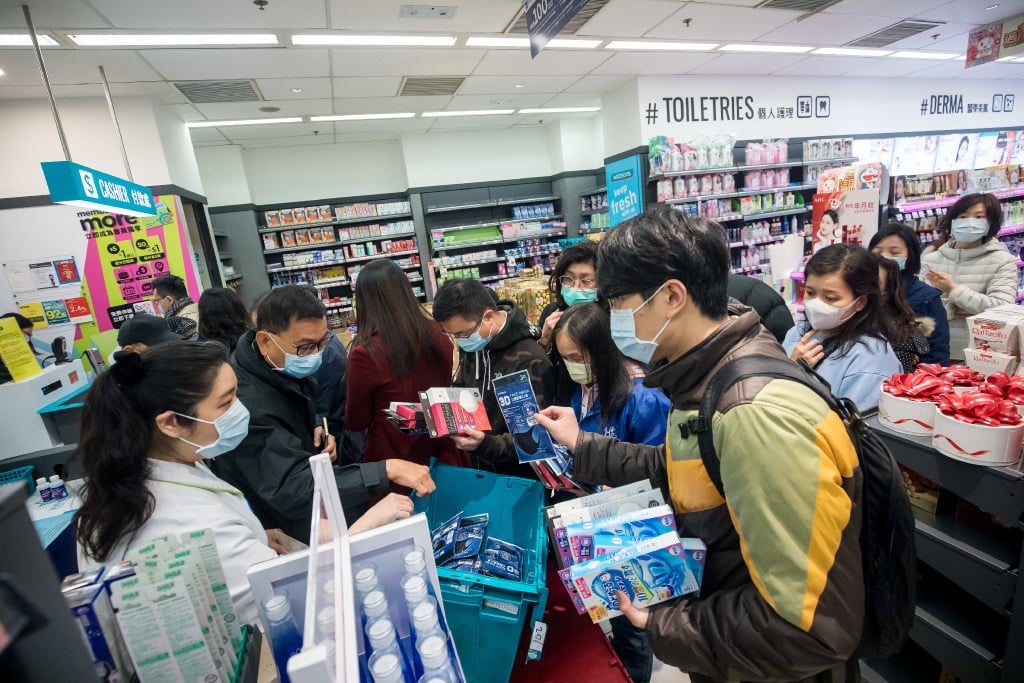 People wait in line to purchase protective masks at a store in Hong Kong on January 29. (Picture: Paul Yeung/Bloomberg)
