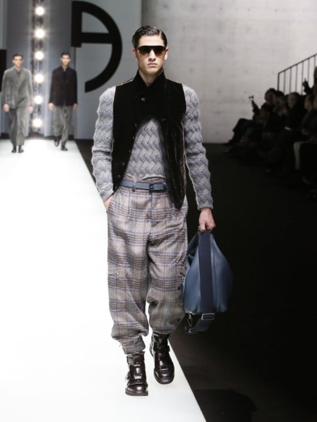 Grey jacquard jumper worn with brown stretch velvet waistcoat, and cargo trousers in beige macro-check alpaca wool.