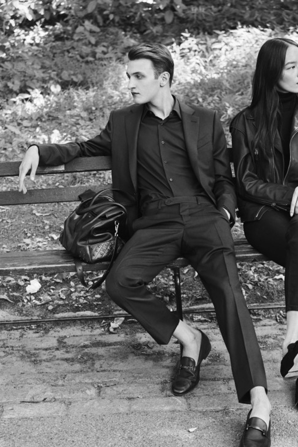 Tod’s Moccasin loafers in soft leather and Travel bag in smooth leather with iconic rubber pebbles on the bottom.