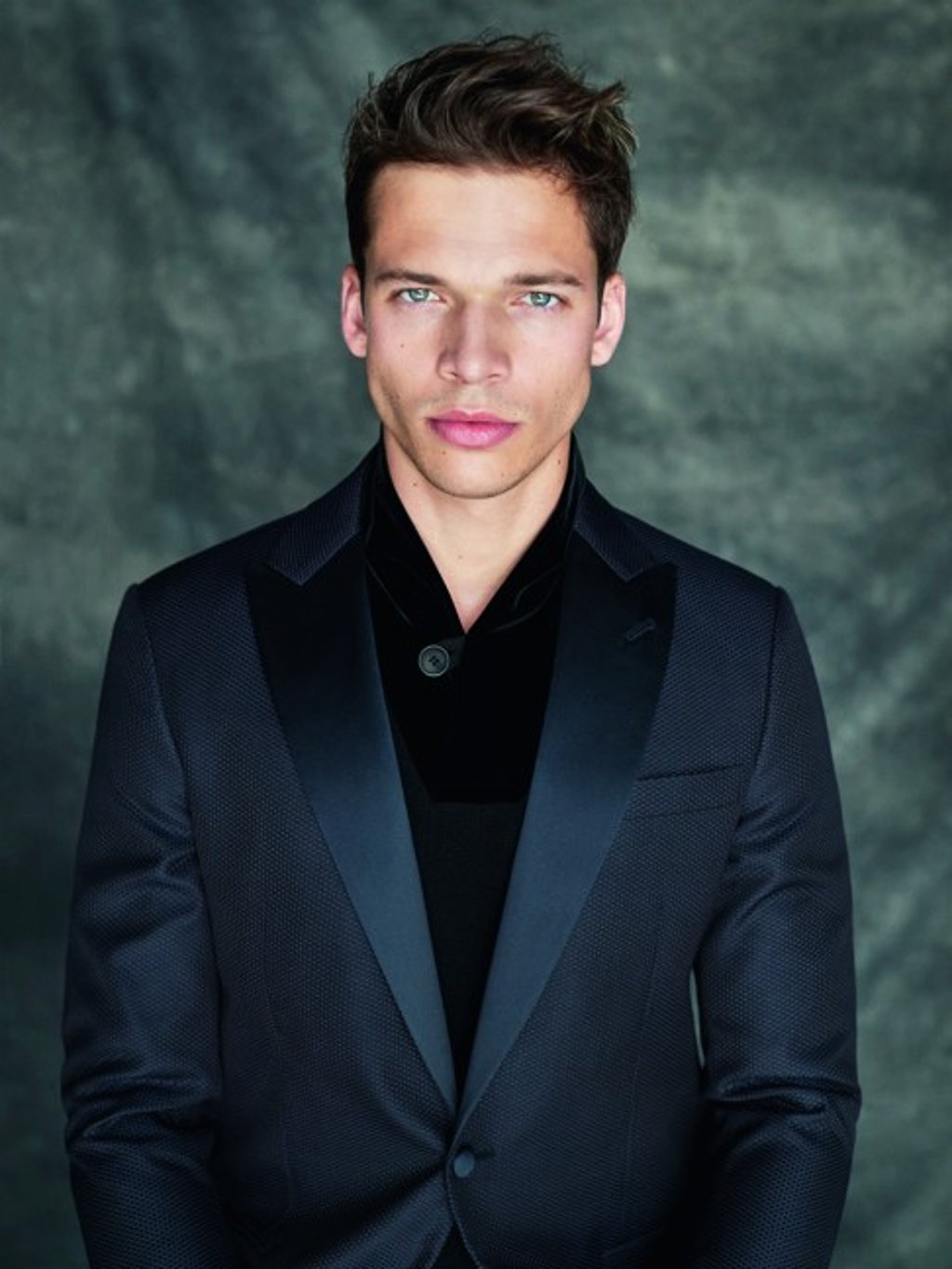 Ultra-elegant black on black tuxedo dressing.