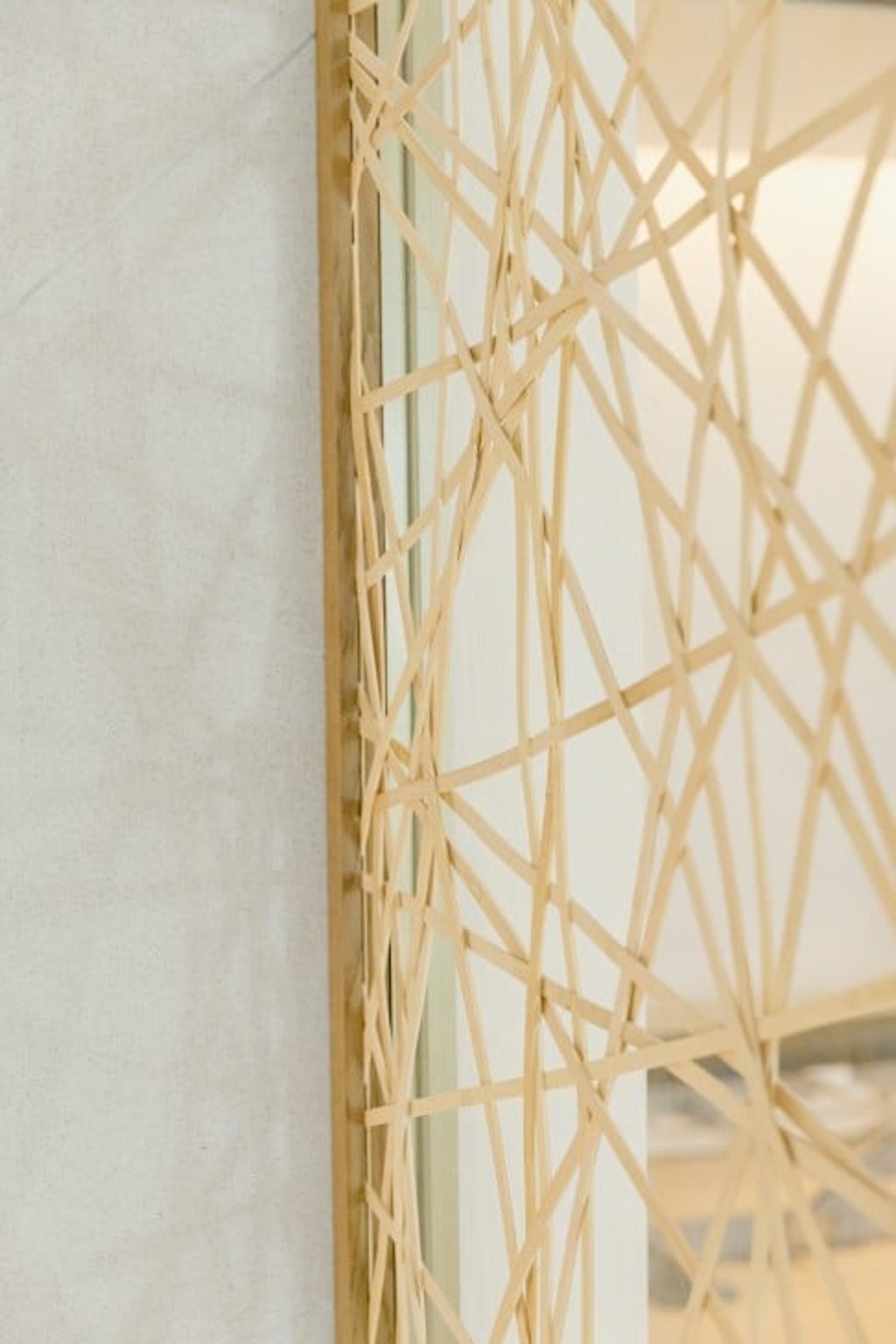 A web-like screen intricately hand woven with strips of bamboo* A web-like screen intricately hand woven with strips of bamboo*