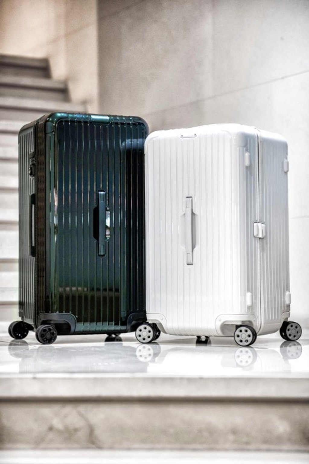 RIMOWA Essential Trunk Plus in green gloss and Trunk in white gloss. Photo courtesy: SCMP