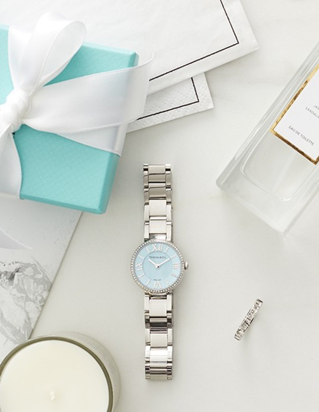 Stack the Atlas® 24 mm women’s watch in stainless steel with diamonds, a Tiffany Blue dial and stainless steel bracelet with a Tiffany T True narrow ring in 18K white gold.