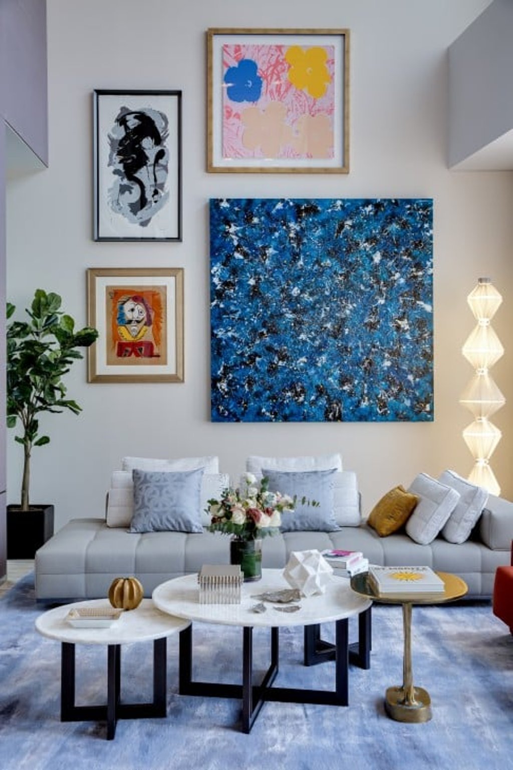On one wall of the living room, works by Pablo Picasso, Andy Warhol, Kazuo Shiraga and DanHôo come together in a bold salon-style display. Elsewhere in the home are works by the likes of Damien Hirst, Lai Chi Man and Elsa Jean de Dieu. (This photo was taken on February 20–21, 2021 at 23–39 Blue Pool Road. This photo has been processed by computerised imaging techniques and is for reference only.)