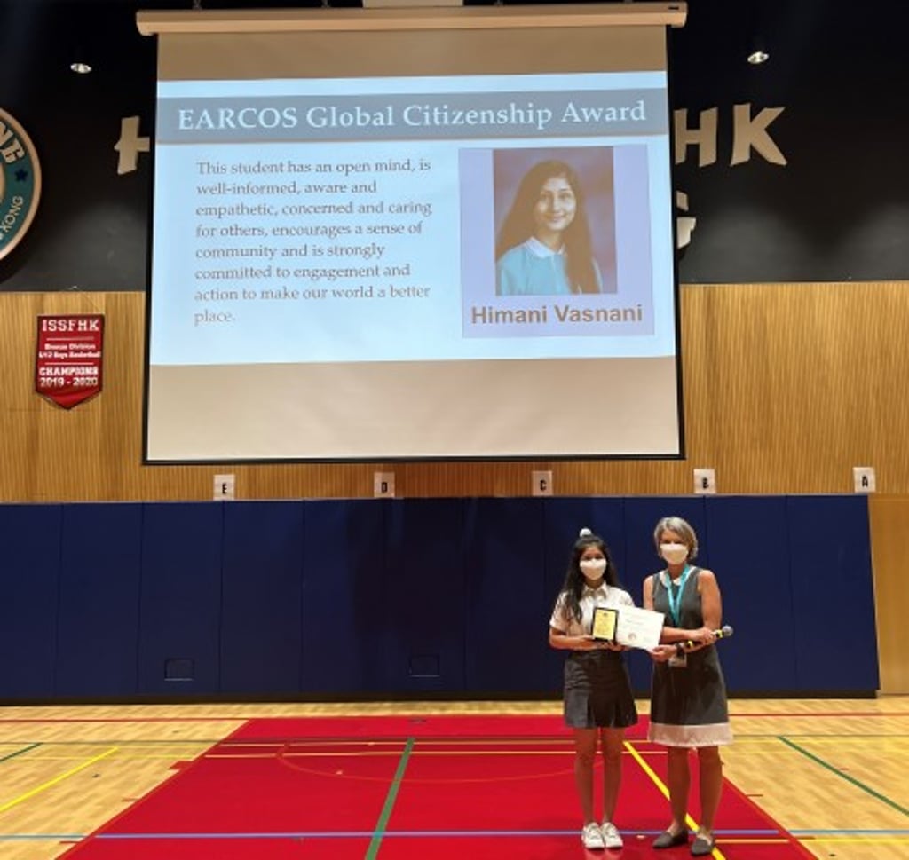 Ms. Shepherd presents EARCOS 2022 Global Citizenship Award to Himani during the monthly Secondary Assembly