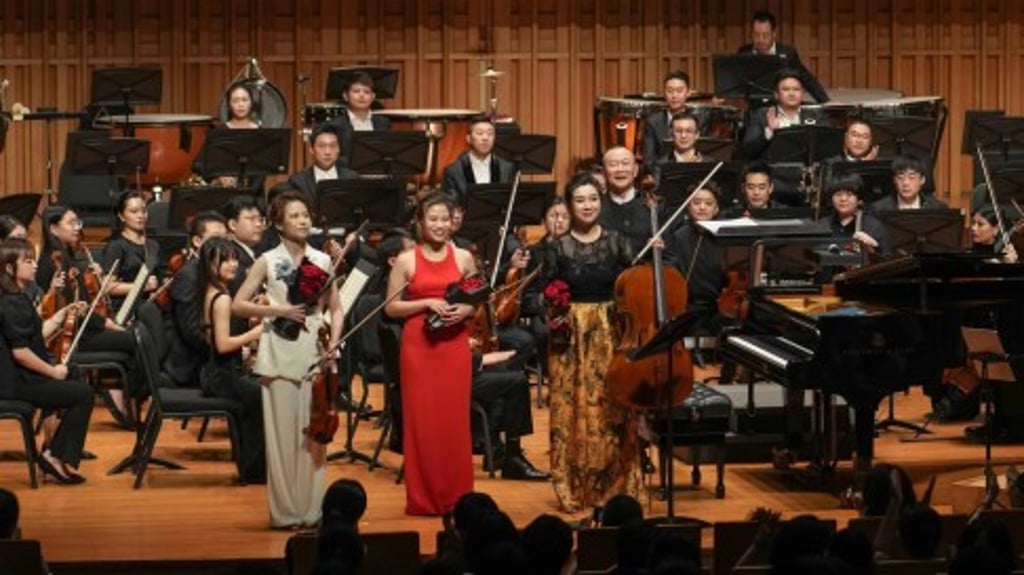 On stage with maestro Tan and the Xi’an Symphony Orchestra in Xi’an: (from left) Nina Wong, Rachel Cheung and Jia Nan.
