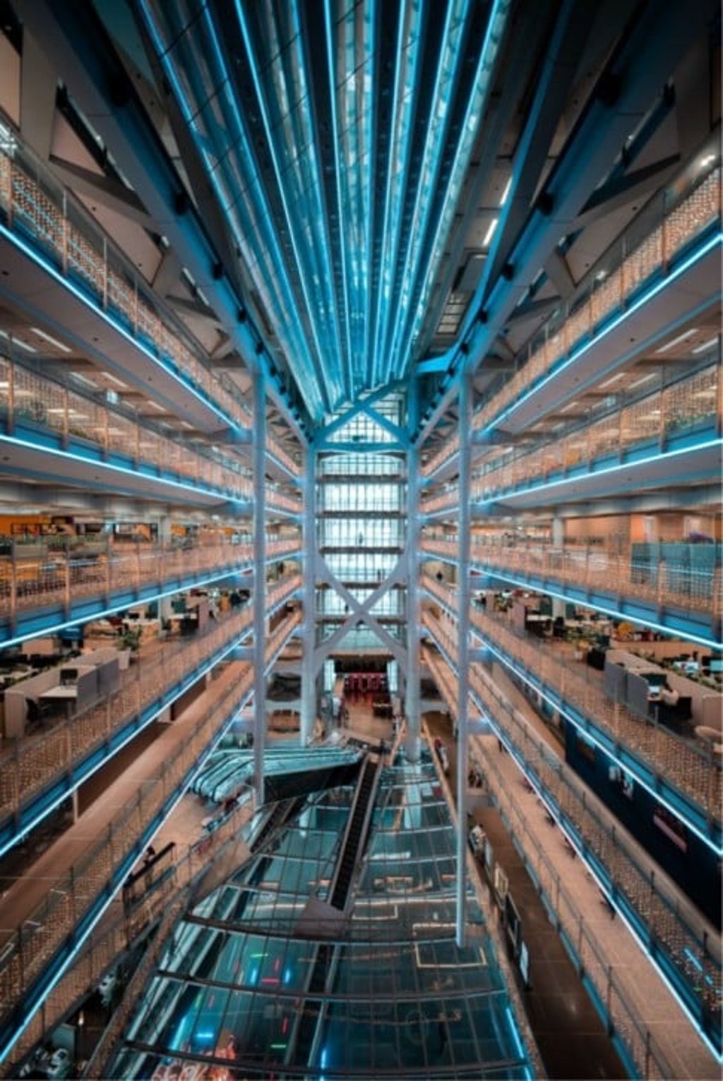 Inside the dramatic 10-storey atrium of the HSBC Main Building, natural light creates a bright and open interior.