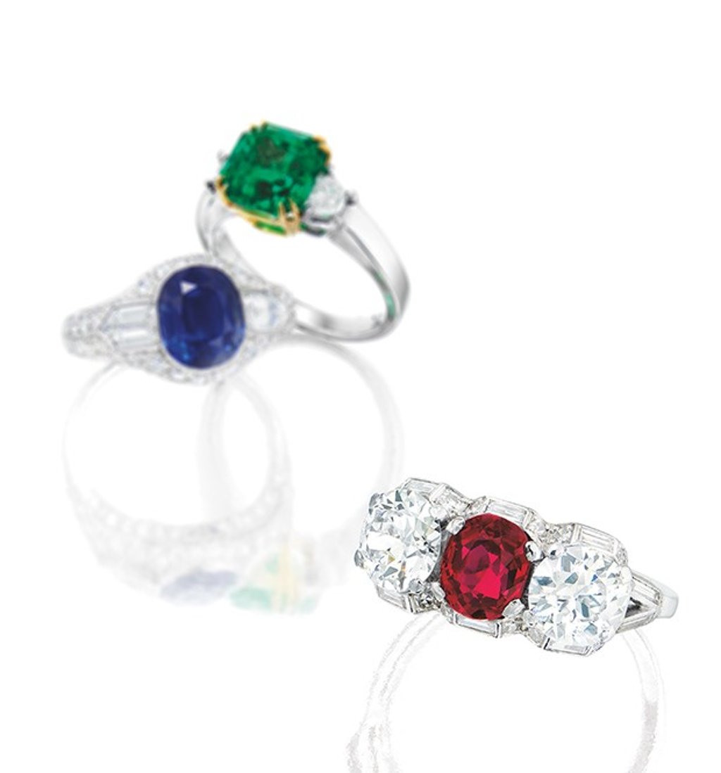 A 1.44-carat Burmese Ruby and Diamond Ring (top), a 3.42-carat Kashmir Sapphire and Diamond Ring (centre) and a 2.77-carat Colombian Emerald and Diamond Ring (bottom).