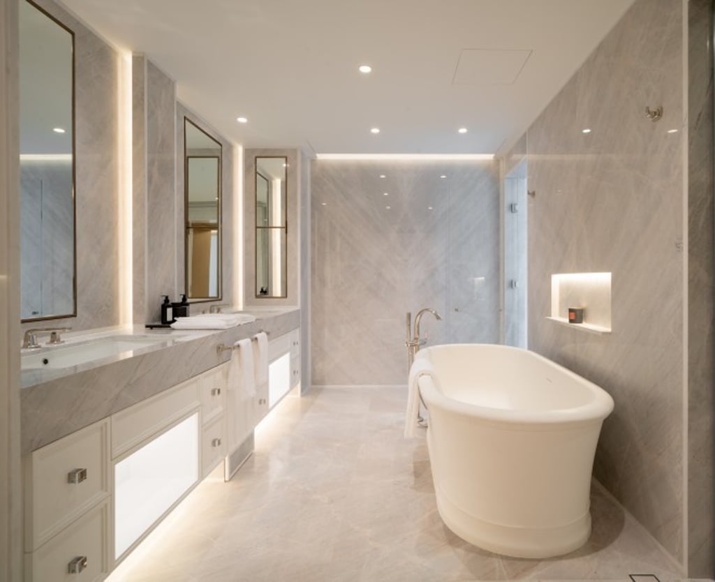 Wrapped in cloudy mist stone, the master bathroom offers a relaxing spa experience.