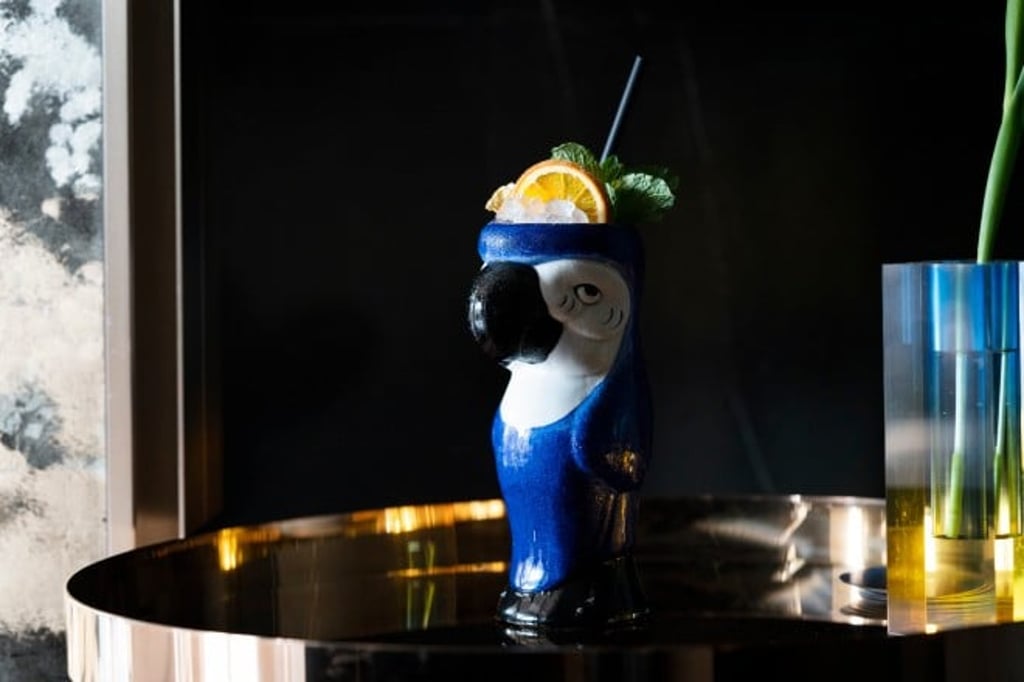 The Brooding Macaw, a striking signature cocktail from The Aviary Collection at Popinjays.