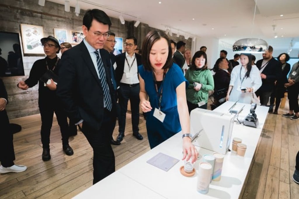 At the "Co-creating Hong Kong" exhibition, the entrepreneurial and creative spirit of Hong Kong was apparent in the designers' showcase. Pictured here is Edward Yau Tang-wah, Secretary for Commerce and Economic Development of the HKSAR Government, visiting the exhibits.