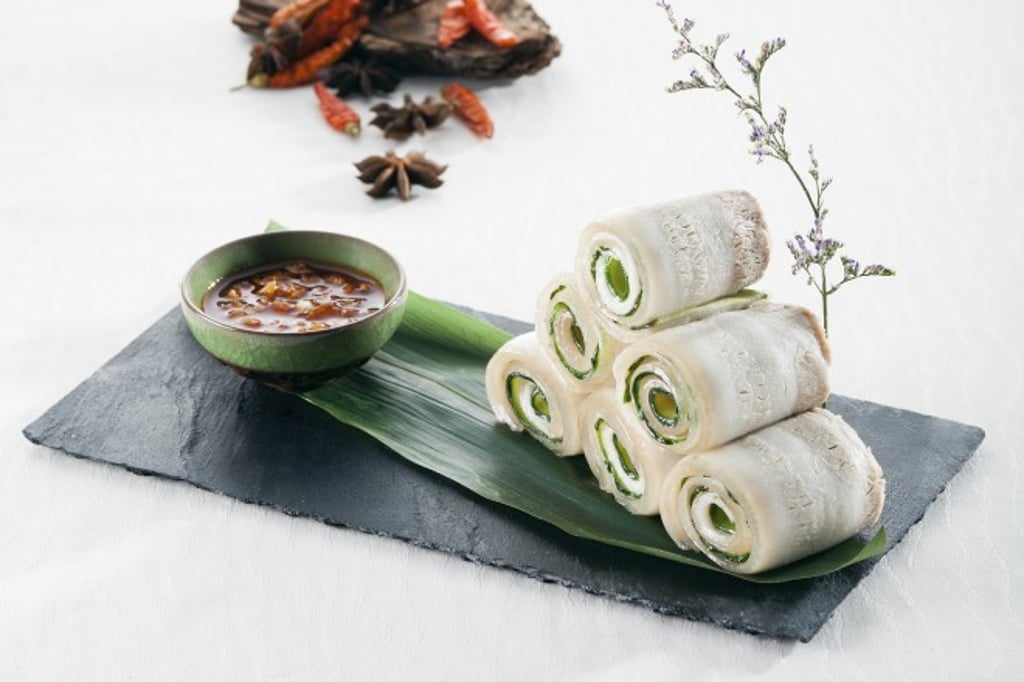 Pork Slices with Mashed Garlic - The finely sliced pork and cucumber display exceptional knife skills