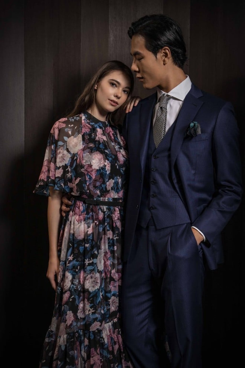 Erdem’s dreamy floral dress with a flounced skirt (on her), and Brioni’s dapper three-piece suit complete with shirt, tie and pocket square (on him) are a perfect pairing for a romantic date night.