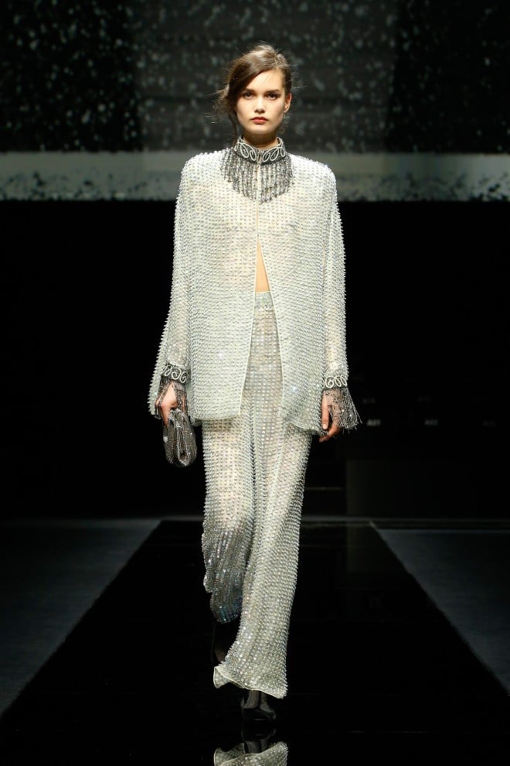 The ultimate pantsuit embellished with glittering grey and green crystal beads and beaded fringes on the collar and cuffs for the evening.