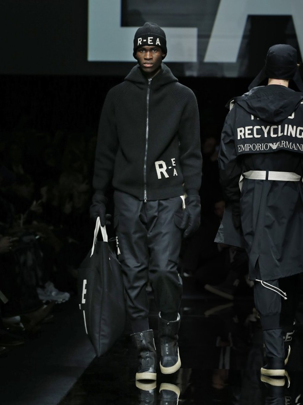 Go full-on R-EA in zipped jumper, cargo pants, moon boots, gloves and beanie.