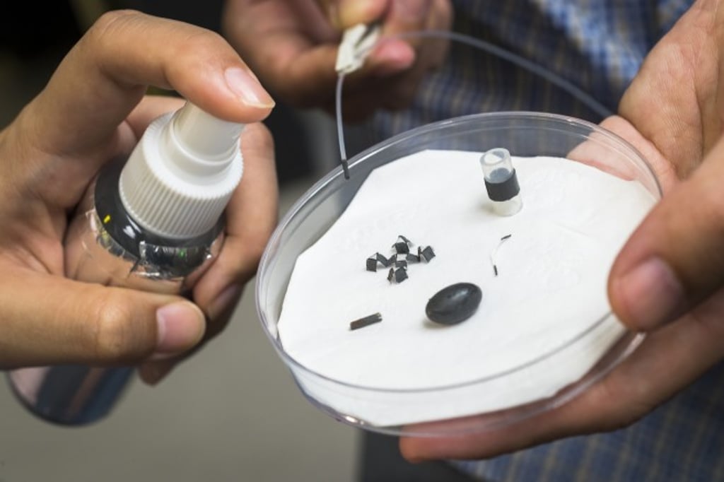 A magnetic force can move an object around different surfaces after it has been sprayed with the M-spray.