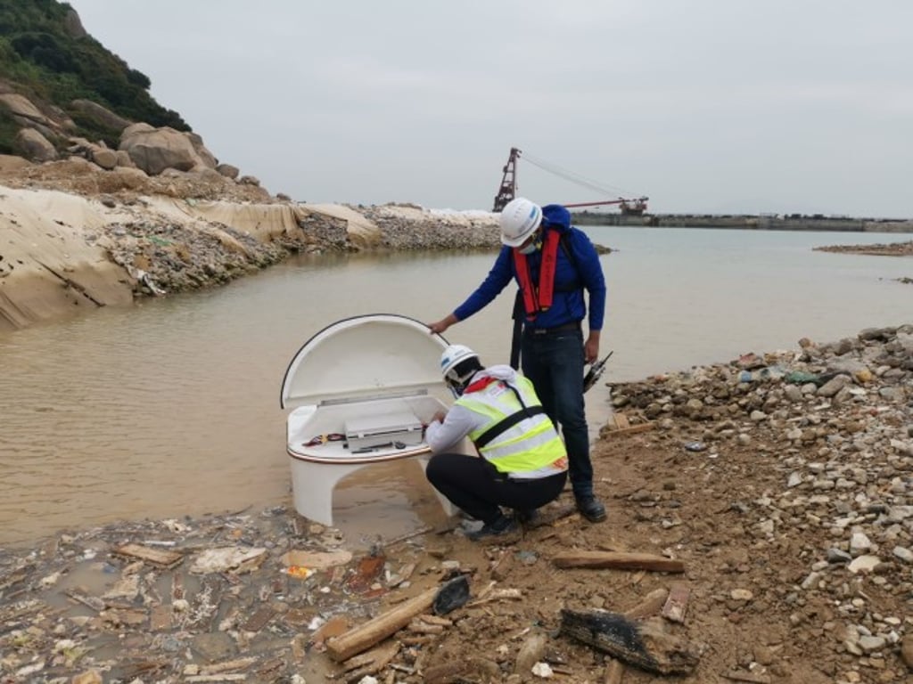 The Clearbot team carries out tests at a land-reclamation site off Shek Kwu Chau, south of Lantau Island in Hong Kong