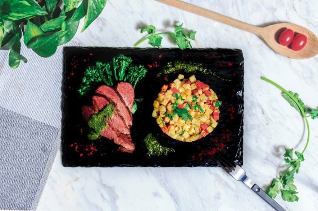 Chimichurri steak with herb potatoes and broccolini.