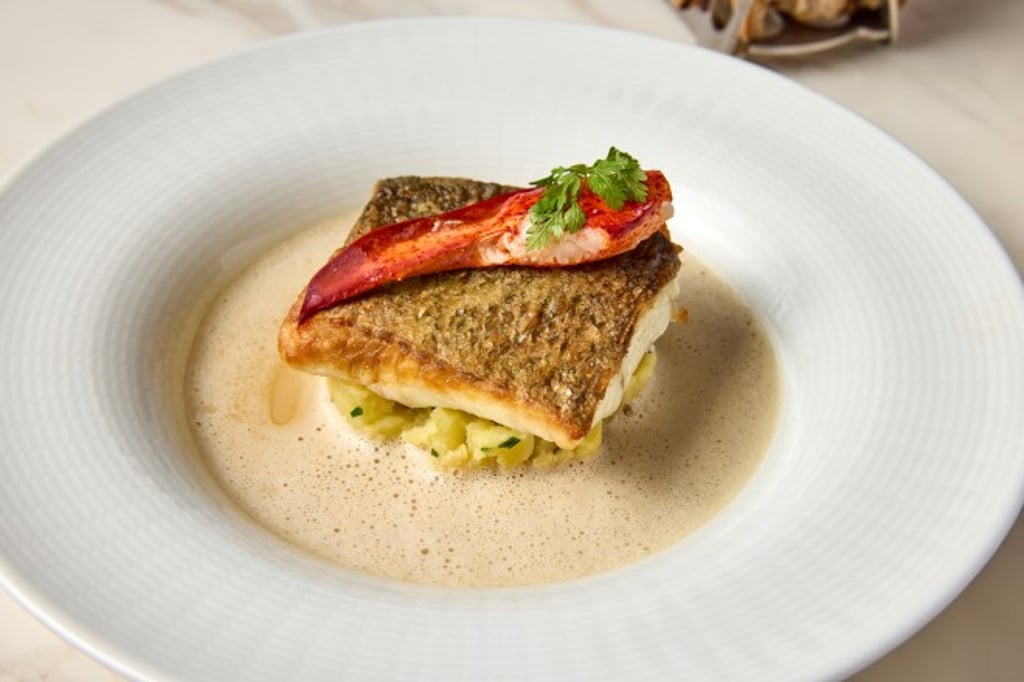 Sea bass served with crushed potatoes and lobster bisque.