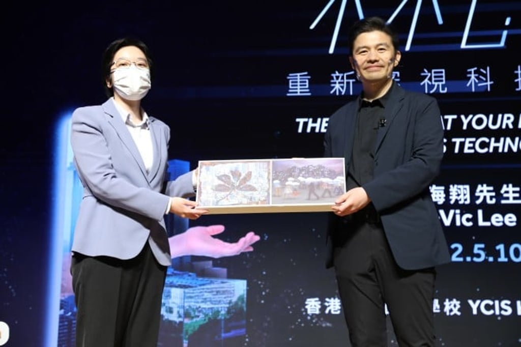 Dr Esther Chan, Deputy Chief Executive Officer (K-12 Education), presents to Mr Vic Lee a souvenir created by an Art student of YCIS.