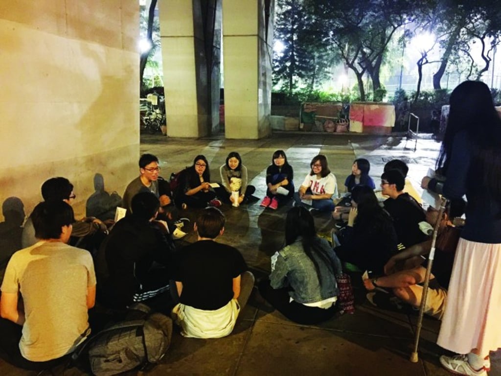 Chan did a debriefing with students after leading them to visit homeless people in Sham Shui Po.