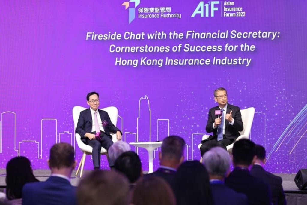 Paul Chan, Financial Secretary of the HKSAR (right), and Chan Kin-por, Non-Official Member of Executive Council and Member of Legislative Council (Insurance) (left) has a fireside chat to examine cornerstones for success of the Hong Kong insurance industry.