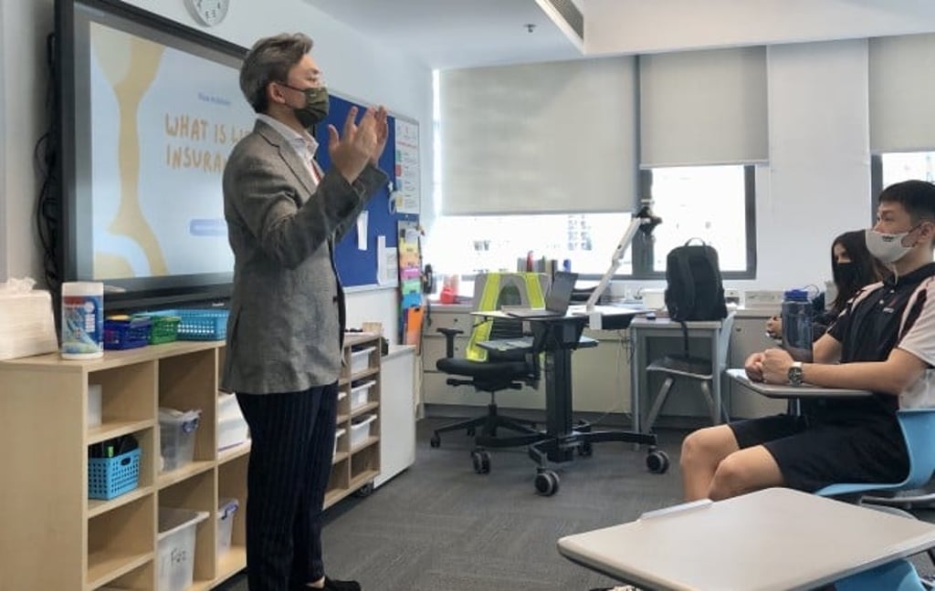 Guest speaker Benjamin Tam sharing with students real-world experience and advice on career paths.