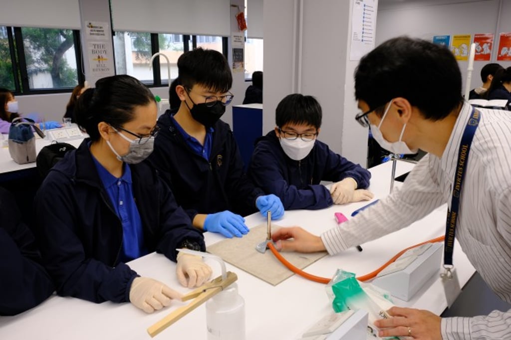 Science experiment at secondary school's science lesson