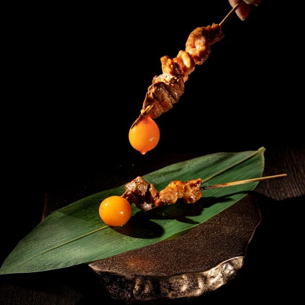 Tori Yoichi serves up skewers of must-try exotic chicken “lantern” grilled to perfection over high-quality Japanese binchotan charcoal Tori Yoichi serves up skewers of must-try exotic chicken “lantern” grilled to perfection over high-quality Japanese binchotan charcoal