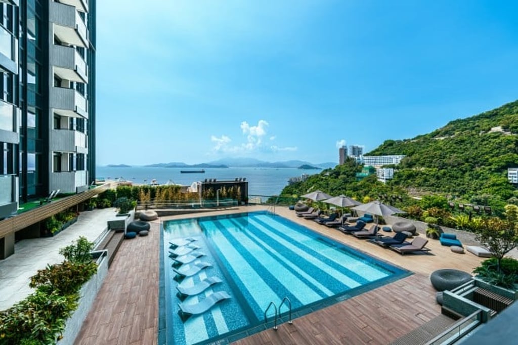 The Victoria Coast Clubhouse is the epitome of urban resort living, with a swimming pool surrounded by stunning sea and mountain views.