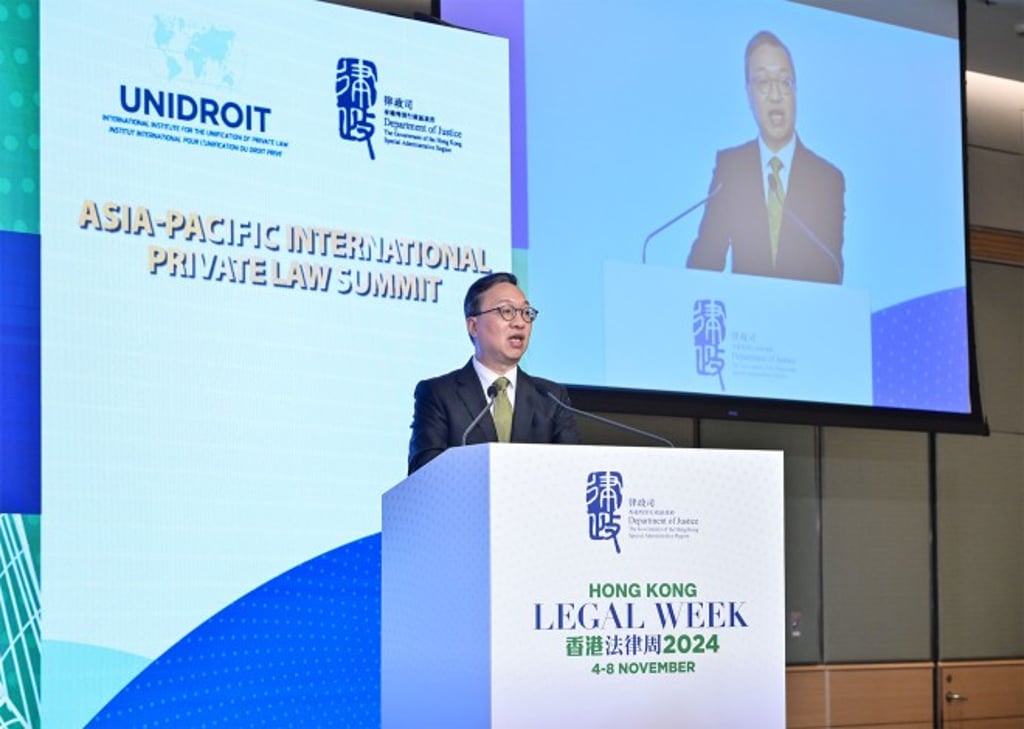 The Secretary for Justice, Paul Lam, delivers welcome remarks at the Summit.