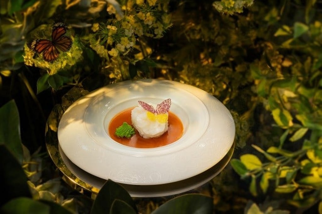 A dish as elegant as its setting. Myanmar king tiger prawn rests in an umami-rich broth, adorned with a delicate butterfly garnish, reflecting the imperial Cantonese sophistication of Palace Garden.