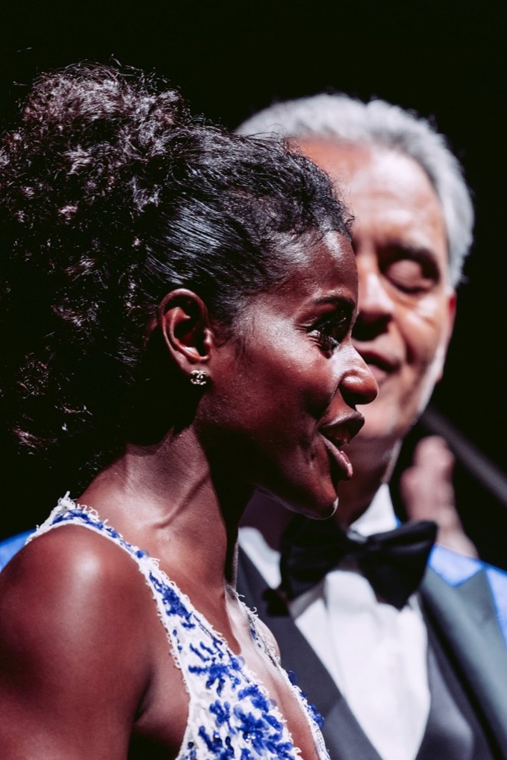 Soprano Mariam Battistelli graces the stage with radiant clarity, her voice illuminating the hall in a moment of serene beauty beside Andrea Bocelli. (Photo credit: Luca Rossetti)