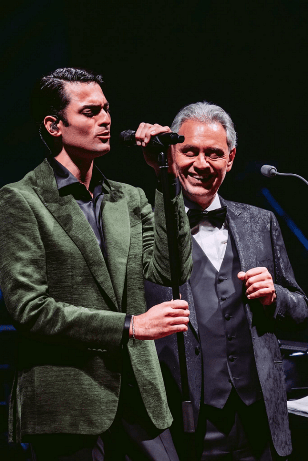 Andrea Bocelli shares an emotional moment on stage with his son Matteo Bocelli during their heartfelt duet, “Fall On Me” – a stirring blend of legacy, love and harmony. (Photo credit: Luca Rossetti)