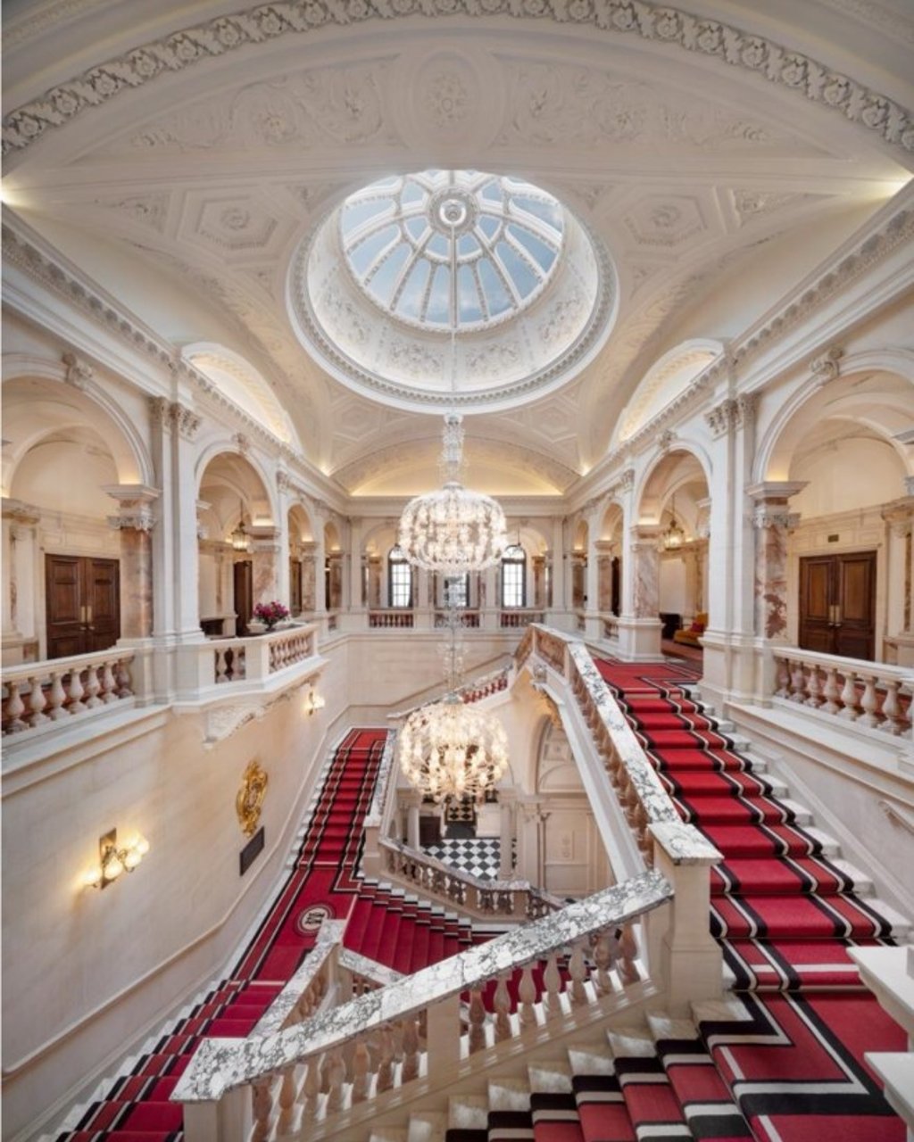 The Grand Staircase at The OWO is a restored centrepiece of the former War Office, now a striking architectural feature of Raffles London.
