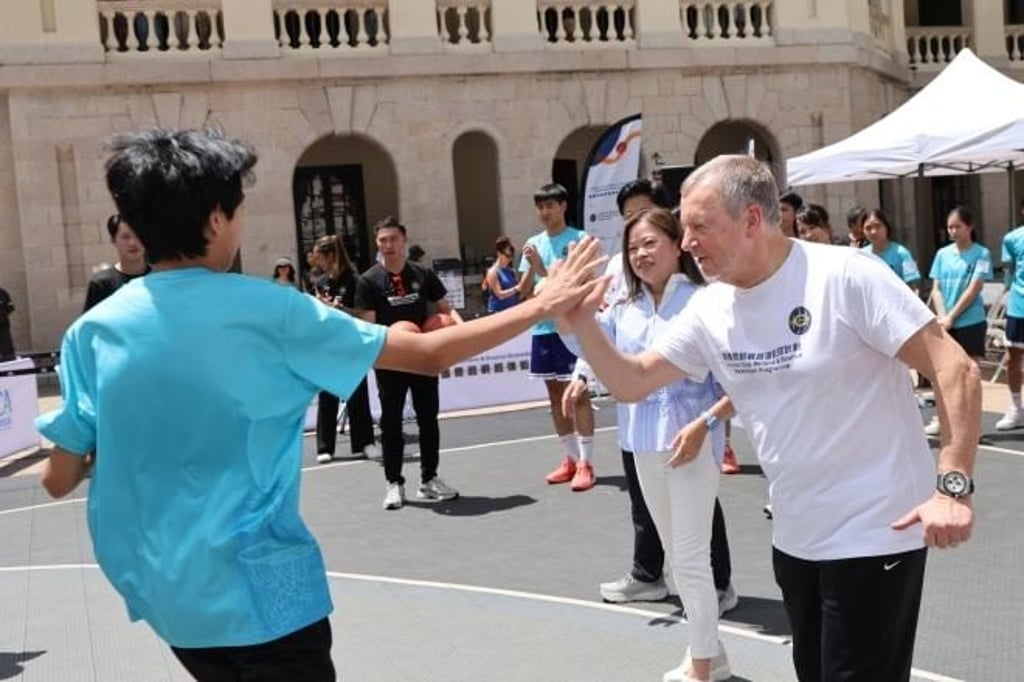 Officiating guests interact with young people during the kick-off ceremony of the Jockey Club Believe & Bounce Basketball Programme.