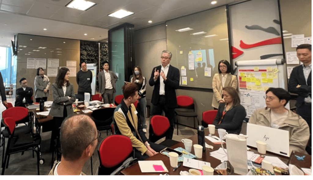 Lawrence Lam engages the scrum team on transformative initiatives that elevate customer service excellence.