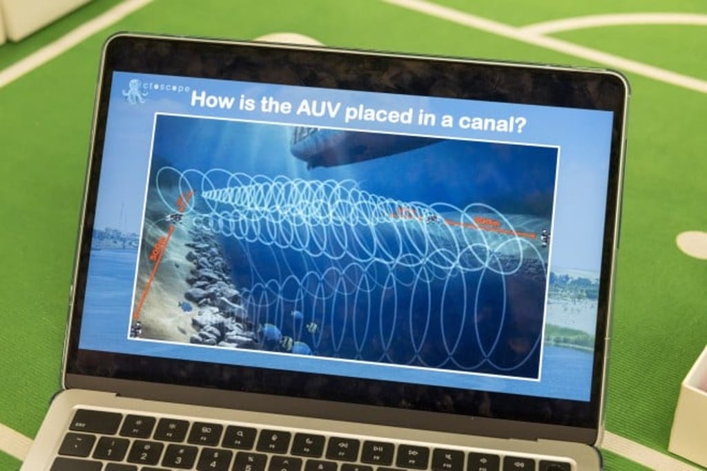 A visualisation of how OctoScope AUVs would operate in a canal, positioned 500 metres apart to create overlapping sensor coverage beneath passing vessels.
