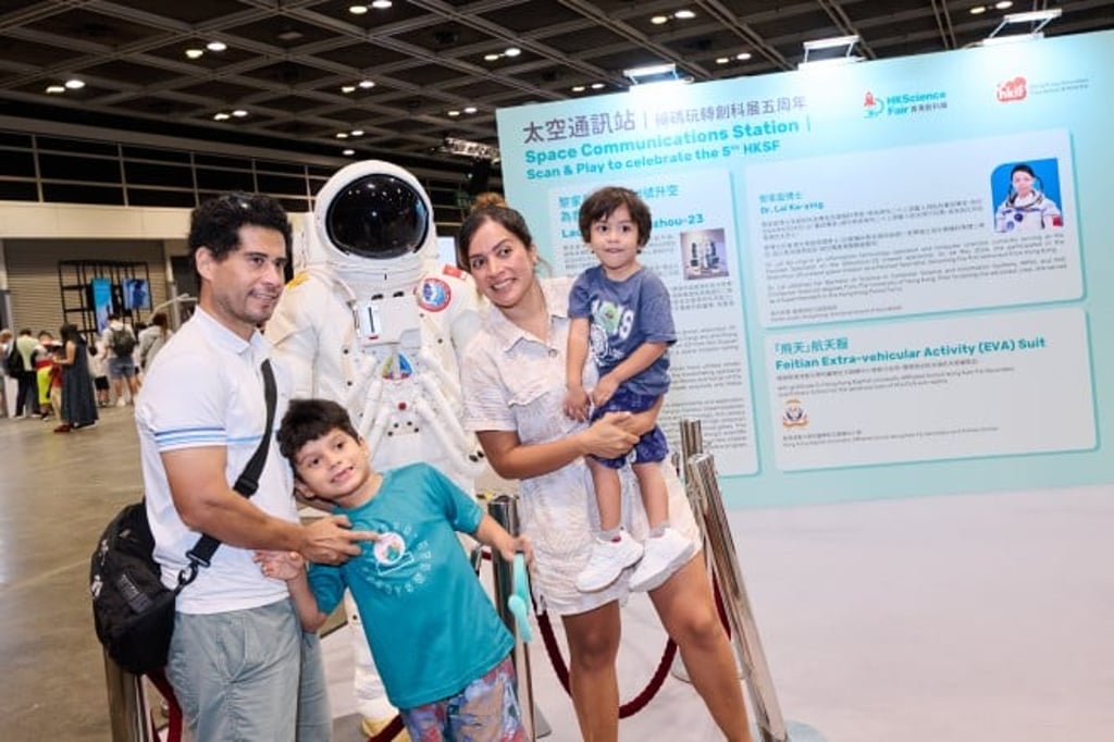 Families engage with humanoid robots and the aerospace exhibition at the Fifth Hong Kong Science Fair, which featured displays honouring Hong Kong’s first astronaut, Dr Lai Ka-ying.